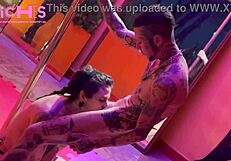 Tattooed beauty dances on pole for audience