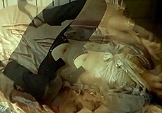 Blonde amateur in black corset satin panties bent over