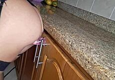 the maid gets hot while cleaning the kitchen and starts masturbating