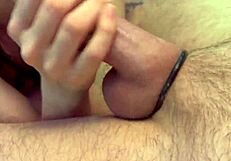 Amateur gives handjob to big cock close up