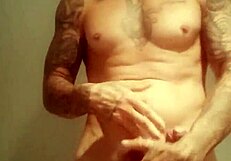 Feeling the thrill of solo pleasure in the shower with a massive cock.