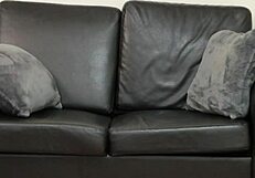 Samantha, a blonde American milf, undergoes casting on sofa.