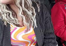 Dirty husband sneaks a quick blowjob in the car during a public ride