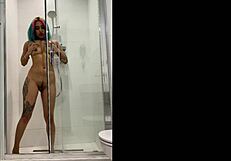 tattooed teen girl bangs her sex toy hard in steamy shower