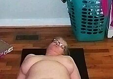 Mature woman with big tits does morning yoga
