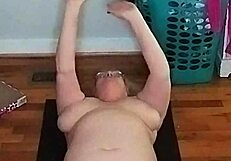 Mature woman with big tits does morning yoga
