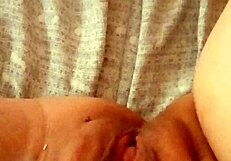 Watch her open her mature pussy at dawn, ready for action!