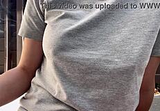 Italian MILF smokes outdoors, big tits exposed!