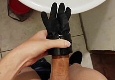 Young amateur with small waist masturbates big cock using homemade fleshlight at work desk