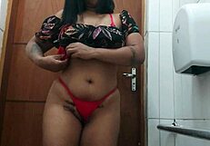 On the beach, she fingers her wet pussy under the sun.