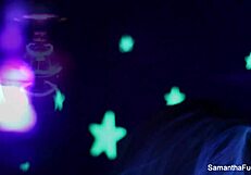 Samantha Saint enjoys lesbian oral with big tits under black light