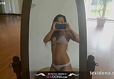 Lexidona Poses in Front of the Mirror During a Teasing Striptease