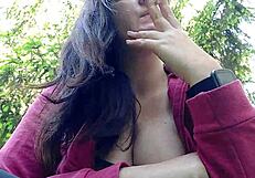 Nicoletta Smokes In A Public Garden And Teasingly Shows Her Big Tits