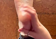 Girl Applies Lotion To Her Feet In A Relaxing Session