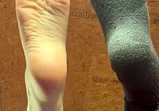 Girl Applies Lotion To Her Feet In A Relaxing Session