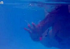 Melissa the mermaid swims in pool with tattoos