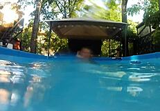 Melissa the mermaid swims in pool with tattoos