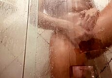 Pretty mature girl filmed in shower showing wet hairy pussy