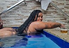 BBW latina drinks by the pool, contrasting sexy curves