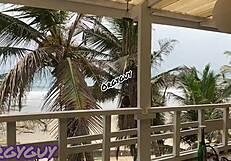 Hey, that ebony wife is flashing her pussy right at the beach house, feeling so bold outdoors