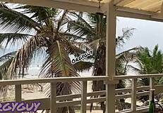 Hey, that ebony wife is flashing her pussy right at the beach house, feeling so bold outdoors