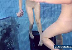 Horny girls strip each other in the pool, ripping clothes