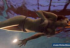 Horny girls strip each other in the pool, ripping clothes