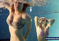 Horny girls strip each other in the pool, ripping clothes