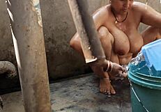 Bhabhi bathing outdoors naked.