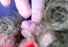 Wow, check out this big clitoris on a hairy pussy in extreme closeup!