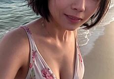 Mature Model Strolls Along the Beach in a Relaxed Manner