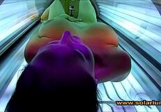 Beautiful woman masturbates on solarium cam