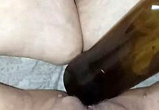 Hey, isn't Gretala the pregnant one rubbing a bottle on her juicy muscular pussy lips?