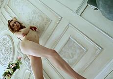 ballerina in tights dances on couch