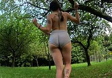 Perfect ass strips while walking in the woods