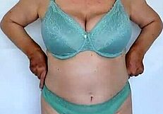 Busty granny Mariaolds shows off natural tits in stockings.