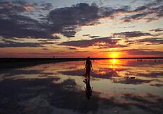 Walking in red sunset at Elton Salt Lake.