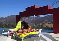 Dee massages and fucks by the pool