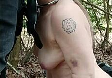 Female Slave Walking In Forest For Dogging