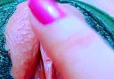 Intensely fingering her strawberry pink shaved pussy to wet orgasm.