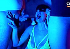 wife indulges in neon-lit threesome sucking two cocks