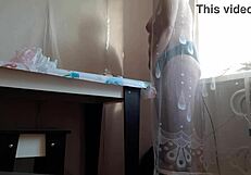 Stepmom caught masturbating behind curtain reaches orgasm.