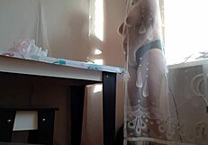 Stepmom caught masturbating behind curtain reaches orgasm.