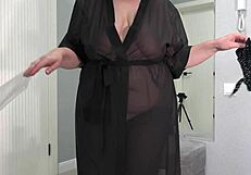 Plump milf with big butt and big boobs tries on sexy bodysuit in front of mirror