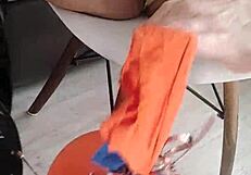 Veve performs balloon popping in latex stockings with a sharp