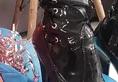 Veve performs balloon popping in latex stockings with a sharp