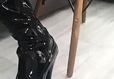 Veve performs balloon popping in latex stockings with a sharp