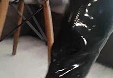 Veve performs balloon popping in latex stockings with a sharp