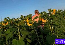 Kitty and Mark in sunflower field