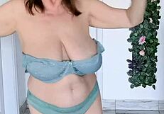 Busty granny mariaold strips and dances in stockings, revealing lingerie and pussy close-up